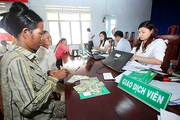 iểm giao dịch của NHCSXH tại xã là địa chỉ quen thuộc của người nghèo và các đối tượng chính sách trên địa bàn tỉnh Gia Lai. Nguồn: VBSP. iểm giao dịch của NHCSXH tại xã là địa chỉ quen thuộc của người nghèo và các đối tượng chính sách trên địa bàn tỉnh Gia Lai. Nguồn: VBSP.